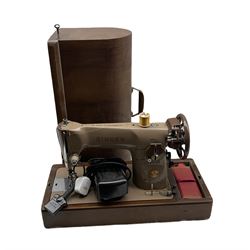 Electronic singer sewing machine in mahogany case