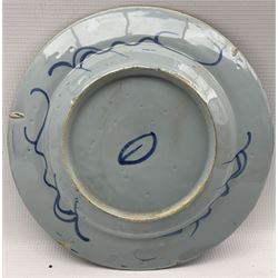 Three 18th century Delft tin glazed earthenware plates, centrally painted with bamboo and rockwork within floral borders, D22cm