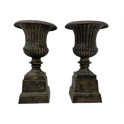 Pair Victorian design cast iron Campana shaped garden urns with base, in black and gilt finish