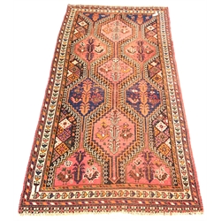  Oriental style red ground flat weave rug decorated with geometric designs and stylised chickens, 130cm x 272cm  