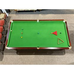 Thurston - 'Standfast' mahogany 10ft snooker table, raised on turned and reeded pilaster supports, together with balls and scoreboard, large rest and cue 