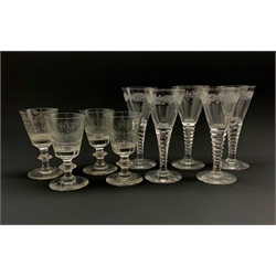 Set of three19th century wine glasses, the bucket shaped bowls engraved with the initials M.W within a laurel leaf garland on knopped stems, a matching wine glass having a rose engraved bowl and the same initials, H10.5cm together with a set of five 19th century style wine glasses (9)