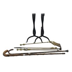 Pair of wrought iron fire dogs H51cm, three-piece brass companion set and two walking canes