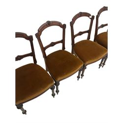 Set four Victorian walnut dining chairs, with upholstered seat, raised on turned and squared supports 