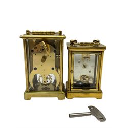 An English eight-day timepiece carriage clock in  a Corniche styled case, with an eleven jewelled movement and lever platform escapement, white enamel dial with Roman numerals, minute markers and steel moon hands, bevelled glass panels to the case and a rectangular glass panel to the top of the case, dial inscribed “Angelus”. With Key.

With a German “Schatz” carriage clock, eight-day movement with an integral key, three clear Perspex panels, with a white dial and visible balance, Roman numerals and minute track, steel spade hands. 
