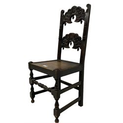 19th century oak Yorkshire side chair, double shaped rail back carved with scrolls and masks, applied split mouldings, panelled seat on turned supports 