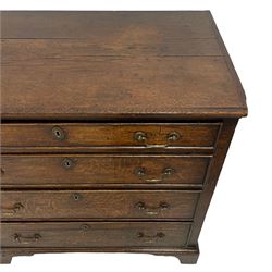 18th century oak chest, rectangular top with moulded edge, fitted with four graduating cock-beaded drawers, each with oval brass escutcheons and drop handles, lower moulded edge over bracket feet