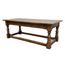 18th century style oak coffee table, the two planked top raised on block and turned supports unite by a stretcher (W122cm, D56cm, H45cm)