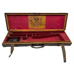 Late Victorian Holland & Holland brass bound leather shotgun case with red baize fitted interior with some accessories, L84.5cm 