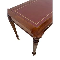 Regency style mahogany writing table, the top with projecting shaped corners and moulded edge with leather inset, fitted with three frieze drawers mirrored by three false drawers, raised on turned and reeded tapering supports, terminating at brass cups and castors, W126cm, H83cm, D66cm