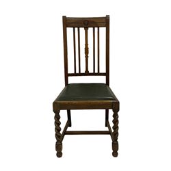 J. R. Teale & Sons (Leeds) - set of four Edwardian oak dining chairs, cresting rail with carved Yorkshire Rose over slat back, green leather drop-in seats, on spiral turned supports united by H-stretcher