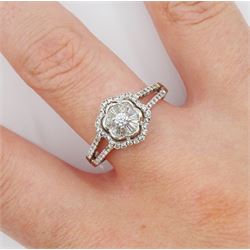 18ct white gold baguette and round brilliant cut diamond flower head cluster ring, with split diamond set shoulders, hallmarked