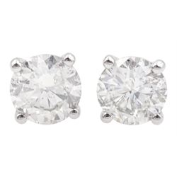 Pair of 18ct white gold round brilliant cut diamond stud earrings, hallmarked, total diamond weight 1.15 carat, with World Gemological institute report