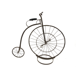 Copy of a Victorian Penny Farthing or high wheeler ordinary bicycle, iron framed, turned fruit wood handle bars, seat on strap iron suspension, with stand, L150cm