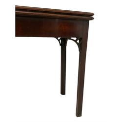 George III figured mahogany card table, the moulded rectangular top opens to reveal a baize lined interior, on concertina action base with sliding storage compartment, on square supports with inner chamfer, fretwork corner brackets