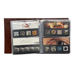 Queen Elizabeth II mint decimal stamps, mostly in presentation packs, face value of usable postage approximately 250 GBP, housed in a ring binder folder