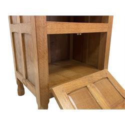 'Oakleafman' adzed oak bedside or lamp table, rectangular top over shelf and double panelled fall front, panelled sides carved with leaf signature, by David Langstaff of Easingwold