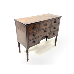 Regency mahogany kneehole sideboard fitted with seven drawers, raised on ring turned supports W110cm