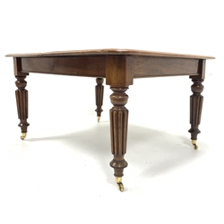 Victorian mahogany extending dining table, rectangular top with moulded edge raised on turned and reeded supports terminating in brass cup castors, (127cm x 113cm, H72cm) with two additional leaves  