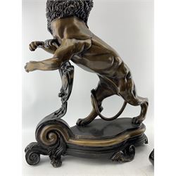 Pair of 20th century bronzed lions rampant, each with dark patina and poised with front paws outstretched, resting on scrolling vacant cartouches, H66cm x W48cm