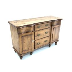 Victorian pine serpentine side board, fitted with five drawers and two cupboards raised on turned supports W136cm, D50cm, H84cm