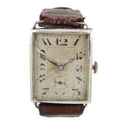 Early 20th century gentleman's silver rectangular manual wind wristwatch, silvered dial with Arabic numerals and subsidereary seconds dial, back case inscribed C.W.F. Read, London import marks 1926, on brown leather strap