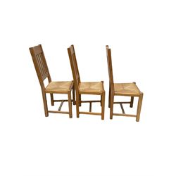Set three high back oak dining chairs, the slat back over rush seat, raised on square supports 