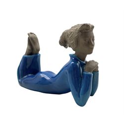 Royal Copenhagen part glazed stoneware figure of a laying woman no. 21952, designed by Johannes Hedegaard, L19cm