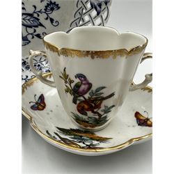 Pair of late 19th century German porcelain chocolate cups and saucers, of quatrefoil form painted with birds and insects, with Helena Wolfsohn AR mark beneath, together with a late 20th century Meissen Onion pattern dish with pierced border, no. 333 D21cm