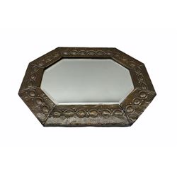 Arts and Crafts octagonal copper mirror with embossed tailing border and bevelled plate, L52cm x H40cm 