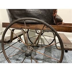 Victorian child's two wheeled dog cart  with buttoned leather tub shape seat,  metal spoke wheels and wooden handles L120cm