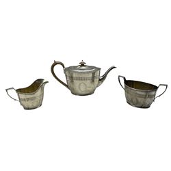 Three piece silver tea set of oval design with engraved decoration and cartouche London 1934 Maker Collingwood & Co 31oz