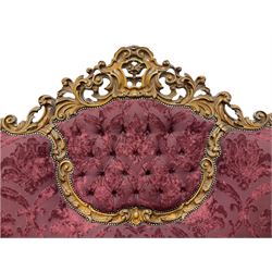 Late 20th century Italian style carved beech framed three seat sofa and pair matching armchairs, the framed carved and pierced with scrolling acanthus leaves and flower heads, cabriole supports, upholstered in buttoned claret fabric with raised foliate pattern 