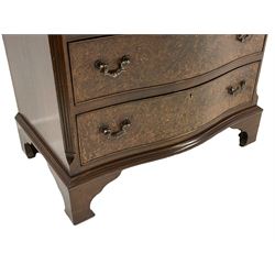 Georgian style figured walnut serpentine bachelor's chest, the moulded top over slide and four graduating drawers, enclosed by canted corners with fluting, lower moulding on bracket feet
