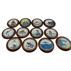 Set of twelve Danbury Mint collectors plates 'The Art of Fishing', with wall hangers