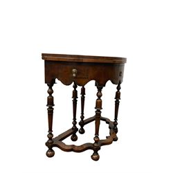 Queen Anne style burr walnut demi lune table, the fold over top over one frieze drawer flanked by two faux drawers, raised on turned supports 