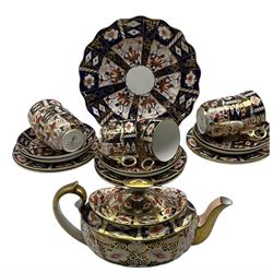 Royal Crown Derby Imari pattern tea set comprising six cups and saucers, six plates and a teapot pattern 2451 and a cake plate pattern 2825