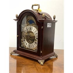 20th century Westminster chiming bracket clock, the stained hardwood case with brass finials and supports, brass dial with moon phase over silvered Roman numeral chapter ring, Hermle movement  with floating balance West German movement, together with an Estyma mantle clock with mechanical movement and photograph frame 