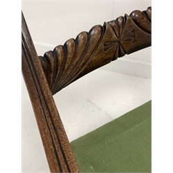 Regency mahogany elbow chair, lobe carved back rail, scrolled and reeded arm supports, drop in upholstered seat pad, raised on turned and reeded front supports 