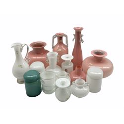 Group of Polish glass in pastel pinks, greens and white comprising two vases of globular form, three cylindrical jars and covers, twin handled vase and others