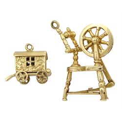 Gold spinning wheel charm and a gold gypsy caravan charm, both hallmarked 9ct