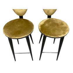Andree Putman for Reflex Angelo - set three bar stools, the oval back and circular swivel seat upholstered in gold fabric with black piping, raised on tapering ebonised supports