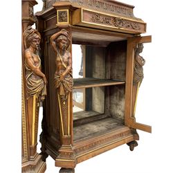 Pair late 19th century walnut and parcel gilt side cabinets, stepped and moulded sarcophagus top carved with bellflower arcade and acanthus leaf, the frieze fitted with single drawer carved with cartouche escutcheon and trailing foliage, bevel glazed door enclosing lined and mirror interior, flanked by carved male and female figure pilasters, stepped and moulded plinth with fluting, lobe carved turned feet