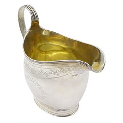 George III silver oval cream jug with engraved vacant cartouche and trailing foliate border with reeded handle London 1802 Maker George Smith and Thomas Hayter 4oz  Provenance: 3rd Earl of Feversham: