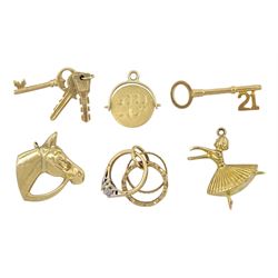 Six 9ct gold pendant/charms including 21 key, good luck spinner, horses head, ballerina, keys and wedding rings, all hallmarked
