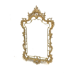 Rococo style cast gilt brass framed wall mirror, the frame decorated with undulating and conforming acanthus scrolls,