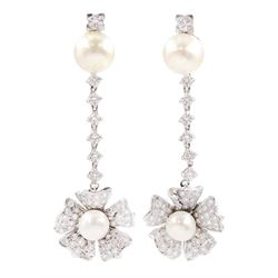 Pair of 18ct white gold cultured pearl and diamond pendant earrings, flower head clusters set with a cultured pearl to diamond set petals, suspended from diamond set chains to cultured pearl and diamond surmounts, total diamond weight approx 1.50 carat 