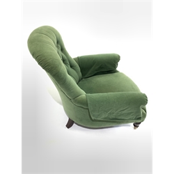  Victorian mahogany framed button back armchair upholstered in green velvet, raised on turned supports and brass cup castors, W76cm 
