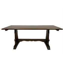 20th century oak refectory table, the rectangular top raised on panel end supports with sledge feet, united by a stretcher 