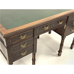 Edwards and Roberts - Edwardian Chippendale revival kneehole desk, moulded rectangular top with leather inset, the front decorated with blind fret work, seven drawers each with 'Cope & Collinson' stamped locks, cluster column supports with spade feet, the centre drawer stamped 'Edwards & Roberts', W122cm, H76cm, D66cm
